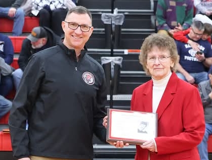 Karen receives the award from Principle Mr. Armstrong